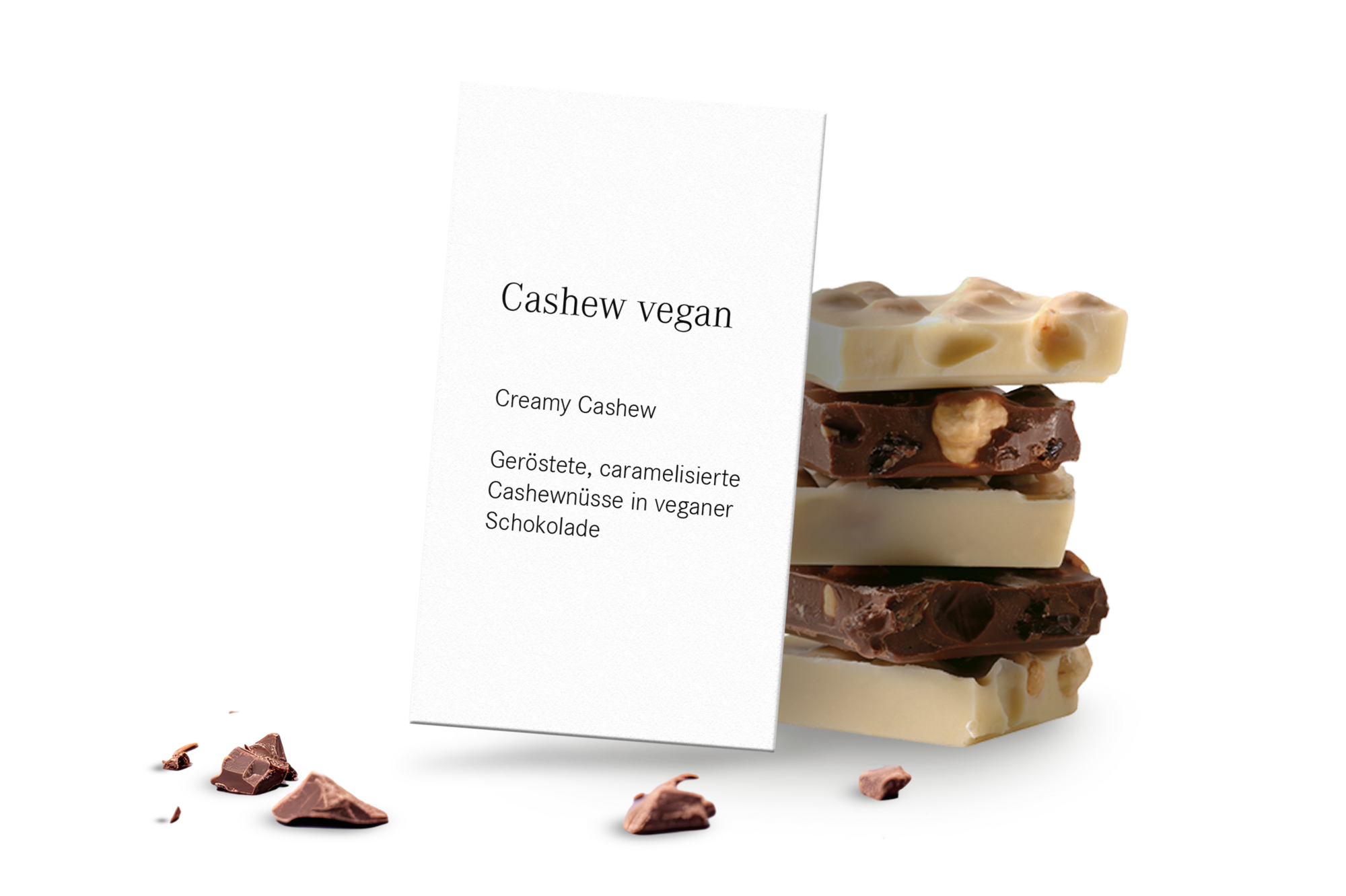 Schild mit Aufschrift Cashew vegan und Schokolade im Hintergrund